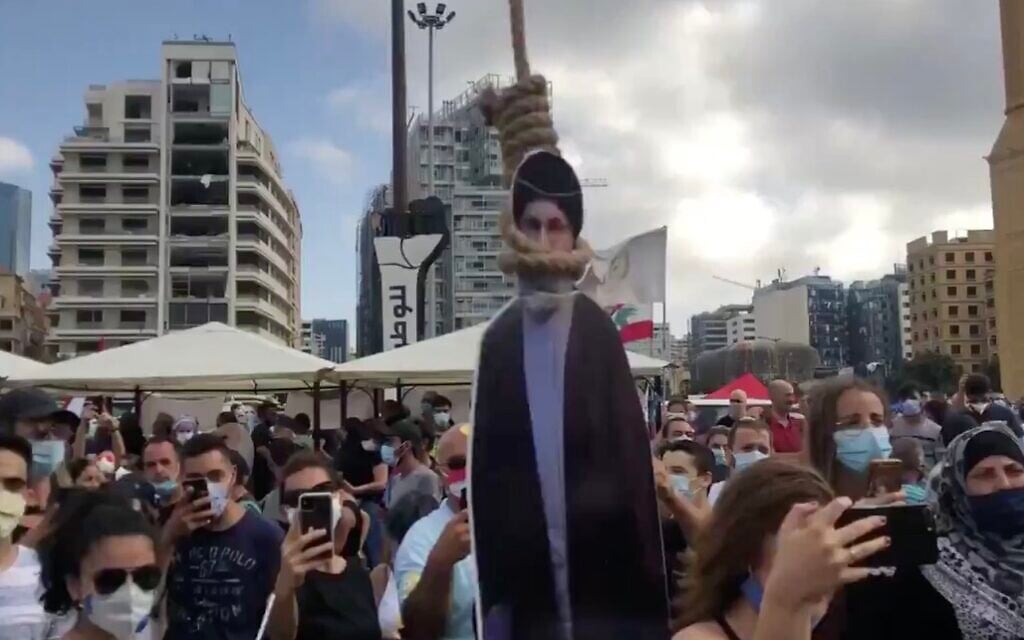 A cardboard cutout of Hezbollah leader Hassan Nasrallah is hung in a noose during a demonstration in Beirut on August 8, 2020, following the deadly blast in the Lebanese capital. (Screen capture: Twitter) A cardboard cutout of Hezbollah leader Hassan Nasrallah is hung in a noose during a demonstration in Beirut on August 8, 2020, following the deadly blast in the Lebanese capital. (Screen capture: Twitter)
