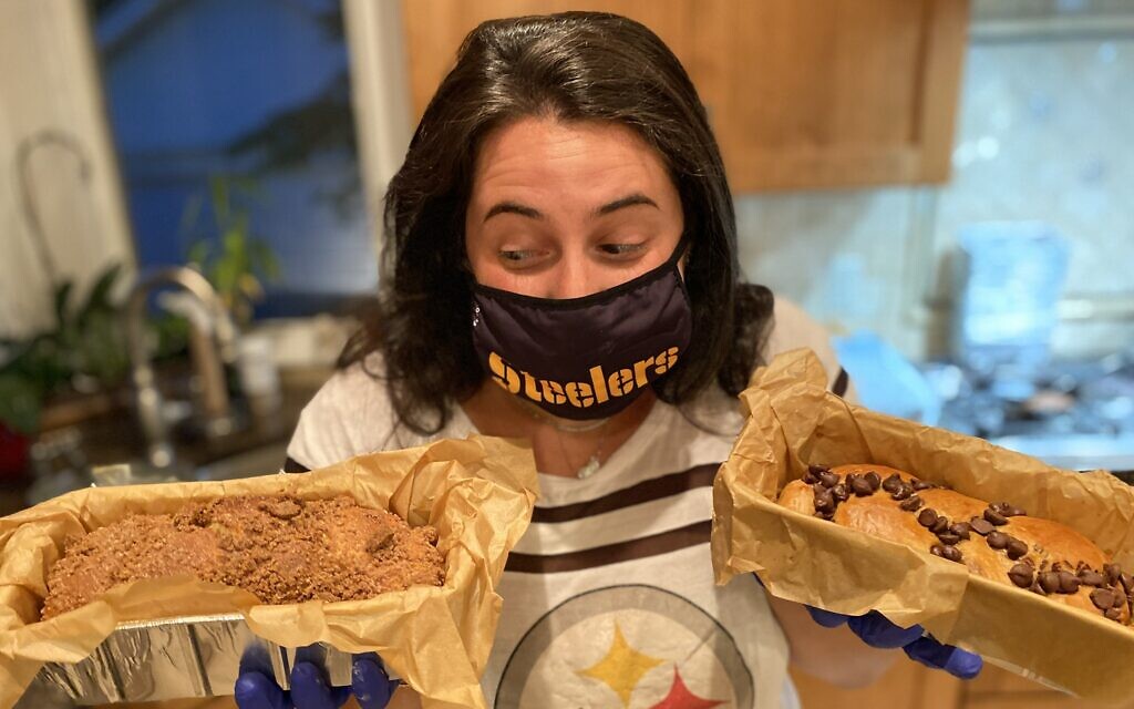 Sara Loffman of the Challah Back Girls weighing the options -- coffee crumb or chocolate chip. (Courtesy)