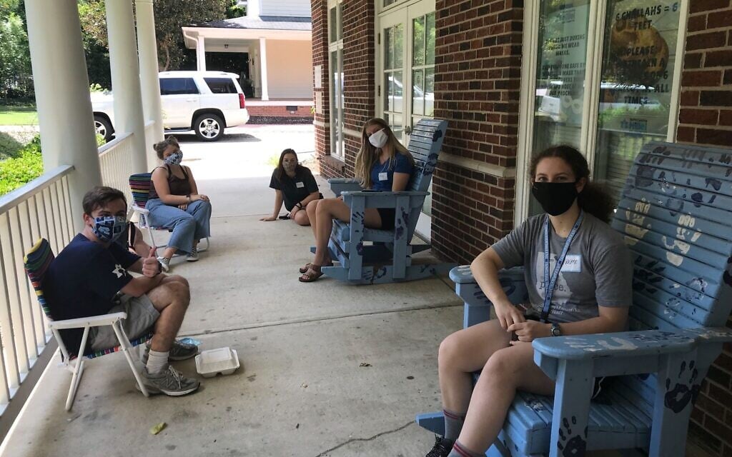 Abigail Adams, sitting in chair on the right with white mask, got to attend one in-person Hillel event at UNC-Chapel Hill before the school shut down. (Courtesy of UNC-Chapel Hill/ via JTA)