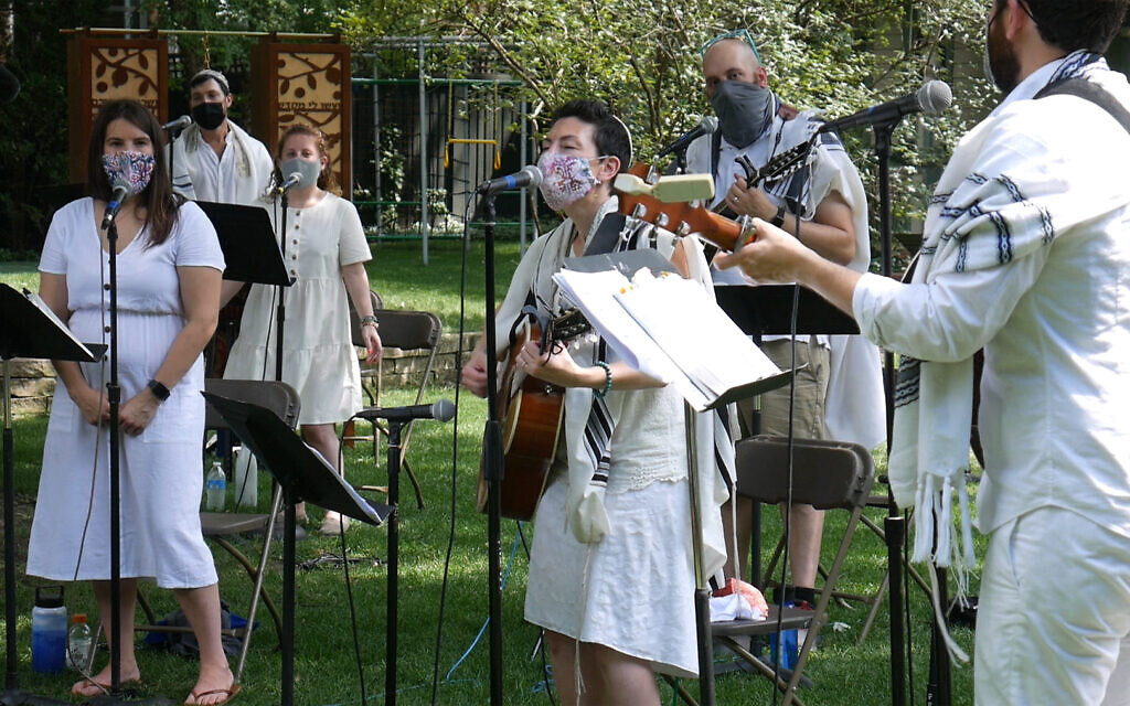 Illustrative: To create a pre-recorded online service, Rabbi Lizzi Heydemann, center, and musicians and singers from Mishkan Chicago recorded the songs and prayers of the High Holidays in August. (Courtesy of See3 Digital Events/ via JTA)