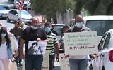 Palestinians protest against the detention by Israel of Boycott, Divestment, Sanctions (BDS) movement coordinator Mahmoud Nawajaa in the city of Ramallah on August 11, 2020. (AFP)