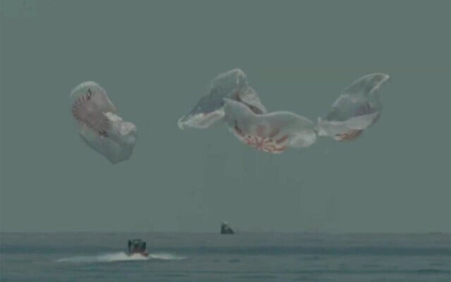 In this frame grab from NASA TV, the SpaceX capsule splashes down Sunday, Aug. 2, 2020 in the Gulf of Mexico. Astronauts Doug Hurley and Bob Behnken spent a little over two months on the International Space Station. It will mark the first splashdown in 45 years for NASA astronauts and the first time a private company has ferried people from orbit. (NASA TV via AP)