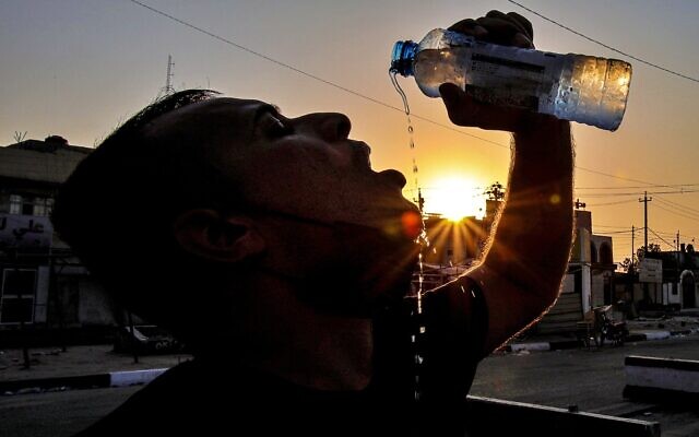 Laith Jabbar, a gas station worker, drinks water in Basra, Iraq, July. 27, 2020. (AP Photo/Nabil al-Jurani) Laith Jabbar, a gas station worker, drinks water in Basra, Iraq, July. 27, 2020. (AP Photo/Nabil al-Jurani)