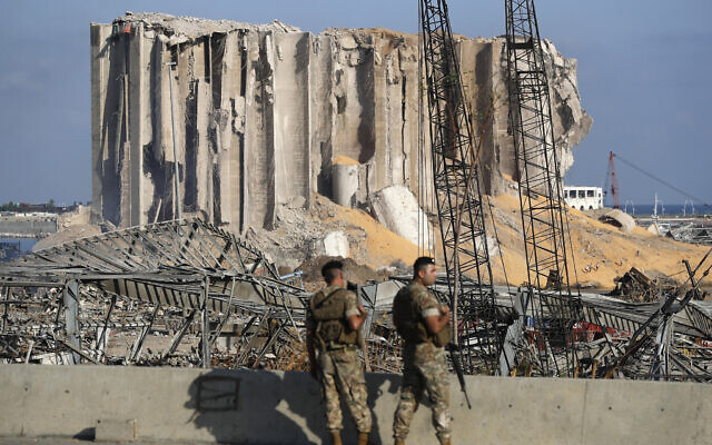 Lebanese army soldiers stand guard at the scene where an explosion hit on Tuesday the seaport of Beirut, Lebanon, August 6, 2020. (AP Photo/Hussein Malla) Lebanese army soldiers stand guard at the scene where an explosion hit on Tuesday the seaport of Beirut, Lebanon, August 6, 2020. (AP Photo/Hussein Malla)