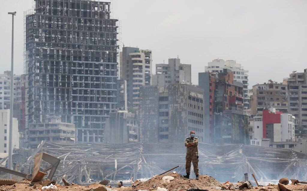 A soldier stands at the devastated site of the explosion in the port of Beirut, Lebanon, Thursday, Aug. 6, 2020 (AP Photo/Thibault Camus, Pool) A soldier stands at the devastated site of the explosion in the port of Beirut, Lebanon, Thursday, Aug. 6, 2020 (AP Photo/Thibault Camus, Pool)