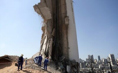 A rescue team surveys the scene of this week's massive explosion in the port of Beirut, Lebanon, Friday, Aug. 7, 2020 (AP Photo/Thibault Camus)