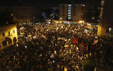 Thousands protest against Prime Minister Benjamin Netanyahu outside his official residence in Jerusalem on August 8, 2020.  (AP Photo/Ariel Schalit)