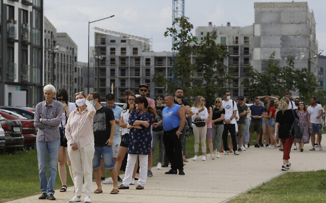 People queue to cast their votes in the Belarusian presidential election in Minsk, Belarus, Sunday, August 9, 2020. (AP Photo/Sergei Grits) People queue to cast their votes in the Belarusian presidential election in Minsk, Belarus, Sunday, August 9, 2020. (AP Photo/Sergei Grits)