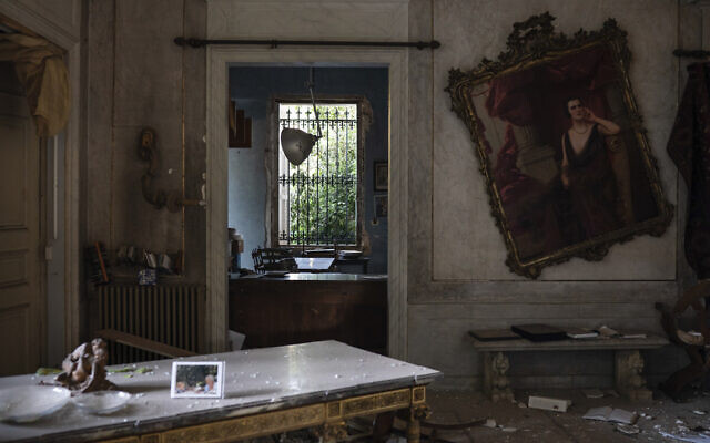 A crooked painting hangs on the wall of the Sursock Palace, heavily damaged after the explosion in the seaport of Beirut, Lebanon, Friday, August 7, 2020. (AP Photo/Felipe Dana) A crooked painting hangs on the wall of the Sursock Palace, heavily damaged after the explosion in the seaport of Beirut, Lebanon, Friday, August 7, 2020. (AP Photo/Felipe Dana)