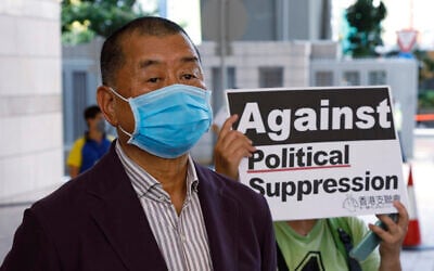 In this July 30, 2020, file photo, Hong Kong media tycoon Jimmy Lai, founder of the local newspaper Apple Daily, arrives a district court in Hong Kong. An aide to Hong Kong media tycoon Jimmy Lai says Lai was arrested Monday morning, Aug. 10, 2020, under the city’s national security law on suspicion of collusion with foreign powers. (AP Photo/Kin Cheung, File)