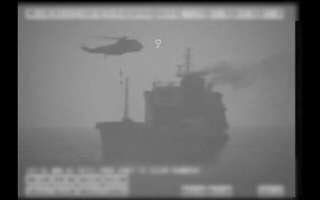 Iranian commandos fast-rope down from a helicopter onto the MV Wila oil tanker in the Gulf of Oman off the coast of the United Arab Emirates, August 12, 2020. (US military's Central Command via AP) Iranian commandos fast-rope down from a helicopter onto the MV Wila oil tanker in the Gulf of Oman off the coast of the United Arab Emirates, August 12, 2020. (US military's Central Command via AP)