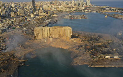 Smoke rises from the scene of the explosion in the seaport of Beirut, Lebanon, August 5, 2020. (AP/Hussein Malla, File)