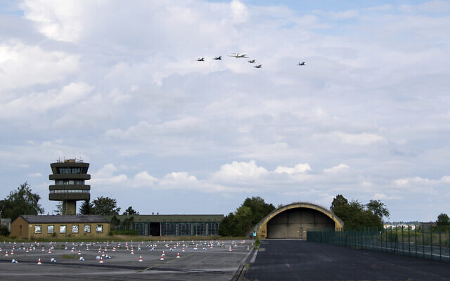German air force Bundeswehr Eurofighters and an Israeli Air Force jets fly in formation over the Fuerstenfeldbruck airbase in commemoration of the 1972 Olympic Games assassination attempt in Fuerstenfeldbruck, Germany, Tuesday, Aug. 18, 2020. (Sven Hoppe/dpa via AP)