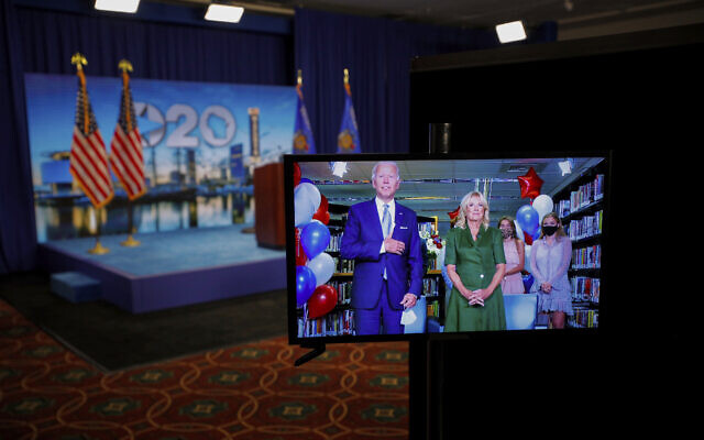 Democratic presidential candidate former Vice President Joe Biden is seen in a video feed from Delaware with his wife Jill Biden, and his grandchildren at his side, after winning the votes to become the Democratic Party's 2020 nominee for President, during the second night of the virtual 2020 Democratic National Convention in Milwaukee, Wisc., Tuesday, Aug. 18, 2020. (Brian Snyder/Pool via AP) Democratic presidential candidate former Vice President Joe Biden is seen in a video feed from Delaware with his wife Jill Biden, and his grandchildren at his side, after winning the votes to become the Democratic Party's 2020 nominee for President, during the second night of the virtual 2020 Democratic National Convention in Milwaukee, Wisc., Tuesday, Aug. 18, 2020. (Brian Snyder/Pool via AP)