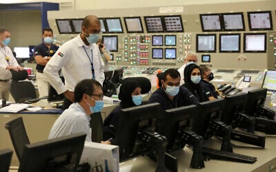In this undated photograph published by the United Arab Emirates' state-run WAM news agency, employees work at the Barakah Nuclear Power Plant in the UAE's far western desert. (WAM via AP)