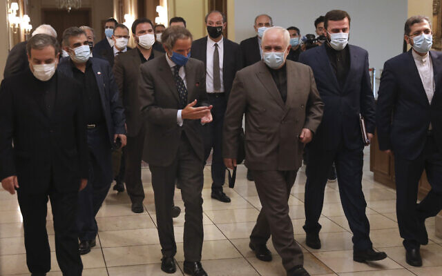 The director general of the International Atomic Energy Agency (IAEA), Rafael Mariano Grossi, center left, speaks with Iran's Foreign Minister Mohammad Javad Zarif, center, before a meeting in Tehran, Iran, August 25, 2020. (AP Photo/Vahid Salemi) The director general of the International Atomic Energy Agency (IAEA), Rafael Mariano Grossi, center left, speaks with Iran's Foreign Minister Mohammad Javad Zarif, center, before a meeting in Tehran, Iran, August 25, 2020. (AP Photo/Vahid Salemi)