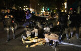 A man being treated after being shot  in Portland, Oregon, August 29, 2020. (Paula Bronstein/AP)
