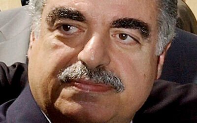 Then Lebanese Prime Minister-designate Rafik Hariri leaves the Parliament building in Beirut, Lebanon April 17, 2003. (AP Photo)