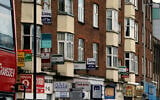 Illustrative: Billboards advertising property for rent and for sale are seen on London's Finchley Road, Wednesday, April 30, 2008. (AP Photo/Max Nash)