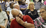 Charles Holt wipe tears from his eyes during a Justice for Sterilization Victims Foundation task force compensation hearing in Raleigh, North Carolina, June 22, 2011 (AP Photo/Jim R. Bounds)