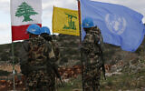 In this December 13, 2018 photo, UN peacekeepers hold their flag while standing next to Hezbollah and Lebanese flags, at the site where Israeli excavators are working, near the southern border village of Mays al-Jabal, Lebanon. (AP/Hussein Malla)