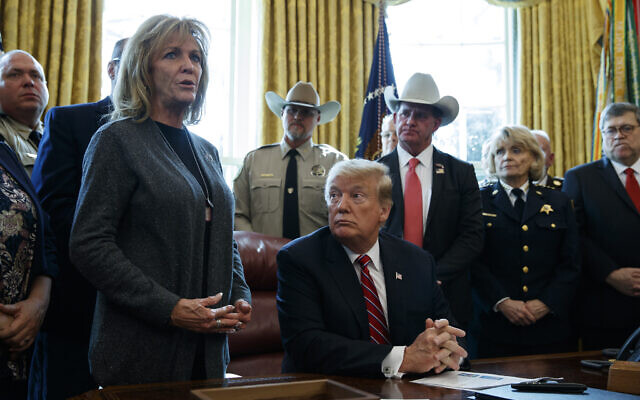US President Donald Trump listens as Mary Ann Mendoza, who lost her son Brandon when he was killed by a drunk driver that was an undocumented immigrant, speaks before he signs the first veto of his presidency in the Oval Office of the White House, Friday, March 15, 2019, in Washington (AP Photo/Evan Vucci) US President Donald Trump listens as Mary Ann Mendoza, who lost her son Brandon when he was killed by a drunk driver that was an undocumented immigrant, speaks before he signs the first veto of his presidency in the Oval Office of the White House, Friday, March 15, 2019, in Washington (AP Photo/Evan Vucci)
