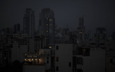 Illustrative: The capital city of Beirut remains in darkness during a power outage, on July 6, 2020. (AP Photo/Hassan Ammar)
