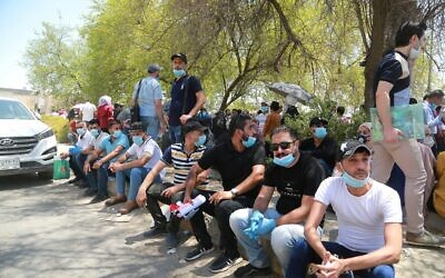 Jobless graduates gather in front of the Ministry of Oil to demand jobs in Baghdad, Iraq, July 20, 2020 (AP Photo/Hadi Mizban)