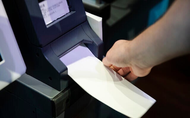 In this June 13, 2019 file photo, an Investigator with the Office of the City Commissioners, demonstrates the ExpressVote XL voting machine at the Reading Terminal Market in Philadelphia (AP Photo/Matt Rourke, File) In this June 13, 2019 file photo, an Investigator with the Office of the City Commissioners, demonstrates the ExpressVote XL voting machine at the Reading Terminal Market in Philadelphia (AP Photo/Matt Rourke, File)