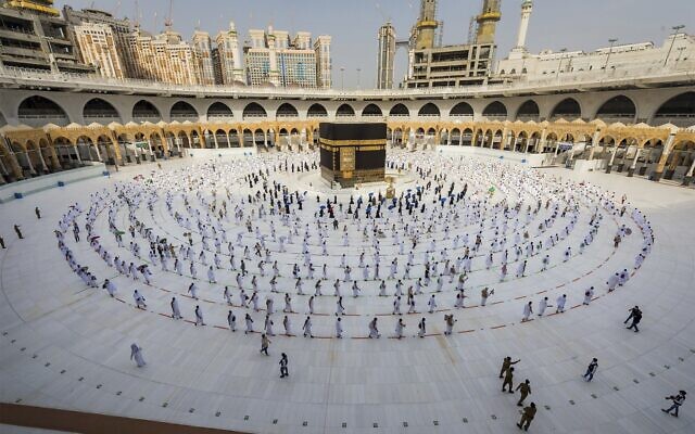 Pilgrims walk around the Kabba at the Grand Mosque, in the Muslim holy city of Mecca, Saudi Arabia, Friday, July 31, 2020. (Saudi Ministry of Media via AP) Pilgrims walk around the Kabba at the Grand Mosque, in the Muslim holy city of Mecca, Saudi Arabia, Friday, July 31, 2020. (Saudi Ministry of Media via AP)