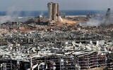 Rescue workers and security officers work at the scene of an explosion that hit the seaport of Beirut, Lebanon, August 5, 2020. (AP Photo/Hussein Malla)