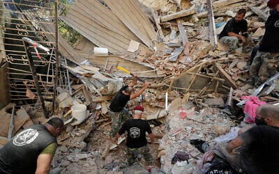 Lebanese soldiers search for survivors after a massive explosion in Beirut, Lebanon, August 5, 2020. (Hassan Ammar/AP)