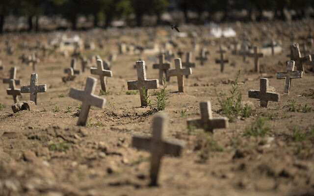 Crosses fill the Caju cemetery, where some victims of the new coronavirus pandemic have been buried, in Rio de Janeiro, Brazil, Friday, Aug. 7, 2020. (AP/Silvia Izquierdo) Crosses fill the Caju cemetery, where some victims of the new coronavirus pandemic have been buried, in Rio de Janeiro, Brazil, Friday, Aug. 7, 2020. (AP/Silvia Izquierdo)