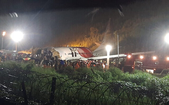 The Air India Express flight that skidded off a runway while landing at the airport in Kozhikode, Kerala state, India, Friday, Aug. 7, 2020. (AP Photo) The Air India Express flight that skidded off a runway while landing at the airport in Kozhikode, Kerala state, India, Friday, Aug. 7, 2020. (AP Photo)