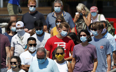 Passengers board a Casco Bay Lines ferry bound for Peaks Island in Portland, Maine, on July 30, 2020. (AP Photo/Robert F. Bukaty)