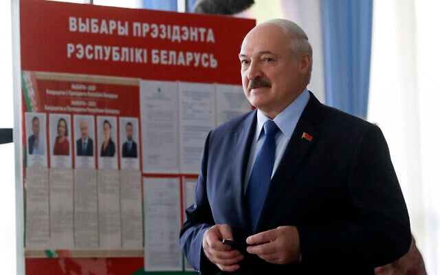 Belarusian President Alexander Lukashenko arrives to vote at a polling station during the presidential election in Minsk, Belarus, August 9, 2020. (AP Photo/Sergei Grits) Belarusian President Alexander Lukashenko arrives to vote at a polling station during the presidential election in Minsk, Belarus, August 9, 2020. (AP Photo/Sergei Grits)