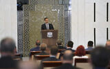 Syrian President Bashar al-Assad addresses the parliament, in Damascus, Syria, August 12, 2020. (SANA via AP)