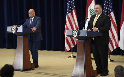 US Secretary of State Mike Pompeo, right, speaks during a news conference with Iraqi Foreign Minister Fuad Hussein, left, at the State Department in Washington, August 19, 2020. (Susan Walsh/AP)