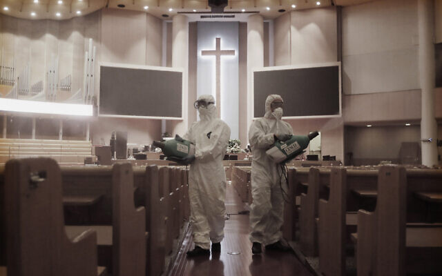 Public officials disinfect pews as a precaution against the coronavirus at the Yoido Full Gospel Church in Seoul, South Korea, Aug. 21, 2020 (AP Photo/Ahn Young-joon) Public officials disinfect pews as a precaution against the coronavirus at the Yoido Full Gospel Church in Seoul, South Korea, Aug. 21, 2020 (AP Photo/Ahn Young-joon)
