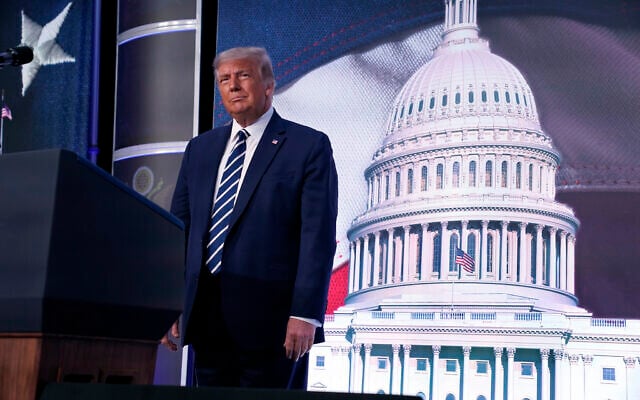 US President Donald Trump stands on stage during the 2020 Council for National Policy Meeting, Aug. 21, 2020, in Arlington, Virginia. (AP Photo/Evan Vucci) US President Donald Trump stands on stage during the 2020 Council for National Policy Meeting, Aug. 21, 2020, in Arlington, Virginia. (AP Photo/Evan Vucci)