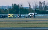 Russian opposition leader Alexei Navalny, center on stretcher, is transported to a German special medical plane at an airport in Omsk, Russia, Aug. 22, 2020 (AP Photo/Elena Latypova)