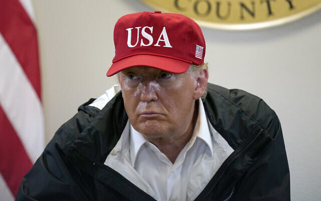 US President Donald Trump listens during a briefing about Hurricane Laura with first responders at the emergency operations center, in Orange, Texas, August 29, 2020. (AP Photo/Alex Brandon) US President Donald Trump listens during a briefing about Hurricane Laura with first responders at the emergency operations center, in Orange, Texas, August 29, 2020. (AP Photo/Alex Brandon)