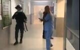 Police carry out searches in the al-Makassed hospital in East Jerusalem after tear gas was fired into the building on August 21, 2020 (Screencapture/Twitter)