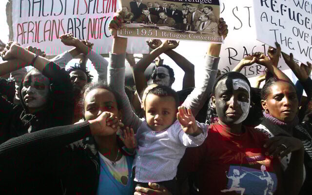 African asylum seekers seen during a protest outside the Ministry of Interior in Tel Aviv, Israel, February 11 2014. (Roni Schutzer/Flash90) African asylum seekers seen during a protest outside the Ministry of Interior in Tel Aviv, Israel, February 11 2014. (Roni Schutzer/Flash90)