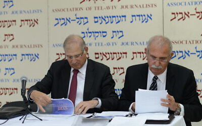David Shimron, attorney for Likud political party (L) with Yaakov Borovsky at a press conference in Tel Aviv on February 17, 2015. (Ben Kelmer/Flash90)