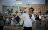A man blows a shofar beachside in Tel Aviv on Rosh Hashanah, September 21, 2017. (Miriam Alster/Flash90/File)