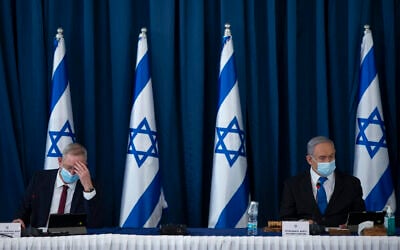 Prime Minister Benjamin Netanyahu, right, and Defense Minister Benny Gantz at the weekly cabinet meeting at the Ministry of Foreign Affairs in Jerusalem, on July 5, 2020. (Amit Shabi/Flash90) Prime Minister Benjamin Netanyahu, right, and Defense Minister Benny Gantz at the weekly cabinet meeting at the Ministry of Foreign Affairs in Jerusalem, on July 5, 2020. (Amit Shabi/Flash90)