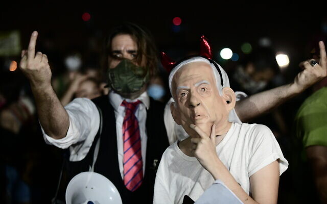 Israelis protest against the Israeli government's handling of the current coronavirus crisis, in Tel Aviv, on August 1, 2020. (Tomer Neuberg/Flash90) Israelis protest against the Israeli government's handling of the current coronavirus crisis, in Tel Aviv, on August 1, 2020. (Tomer Neuberg/Flash90)