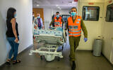 A patient is wheeled into Ichilov Hospital in Tel Aviv on August 3, 2020. (Yossi Aloni/Flash90)