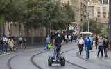 People walk in Jerusalem on August 12, 2020 (Olivier Fitoussi/Flash90)